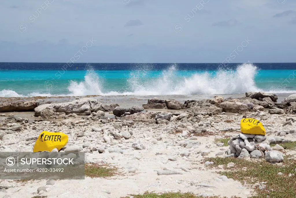 Bonaire, Southern Peninsula, Salt City. Marker stones indicating the entry and exit of the Salt City dive site.