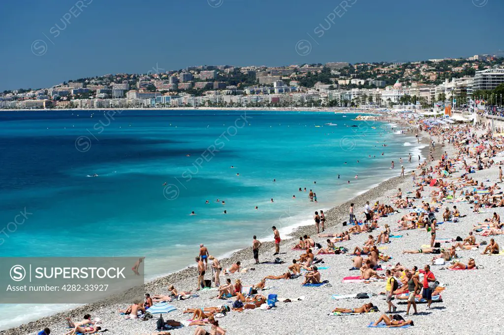 France, Provence Alpes Cote dAzur , Nice. The beach and seafront of the Baie des Anges in Nice.