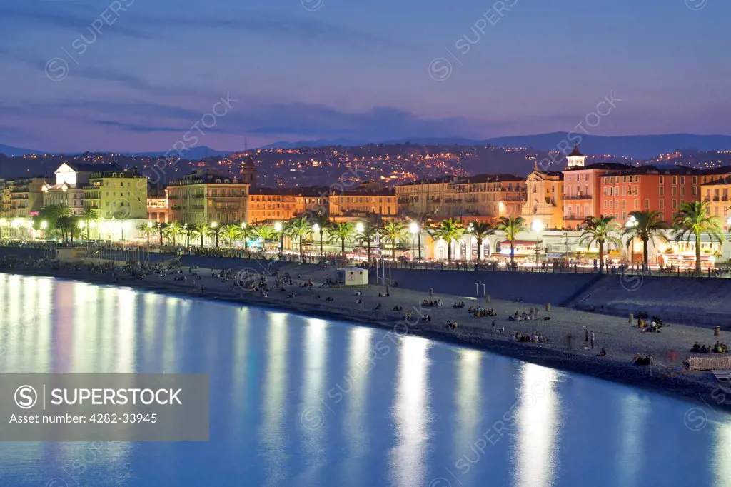 France, Provence Alpes Cote dAzur , Nice. A night time view of the Baie des Anges and its beach in Nice.