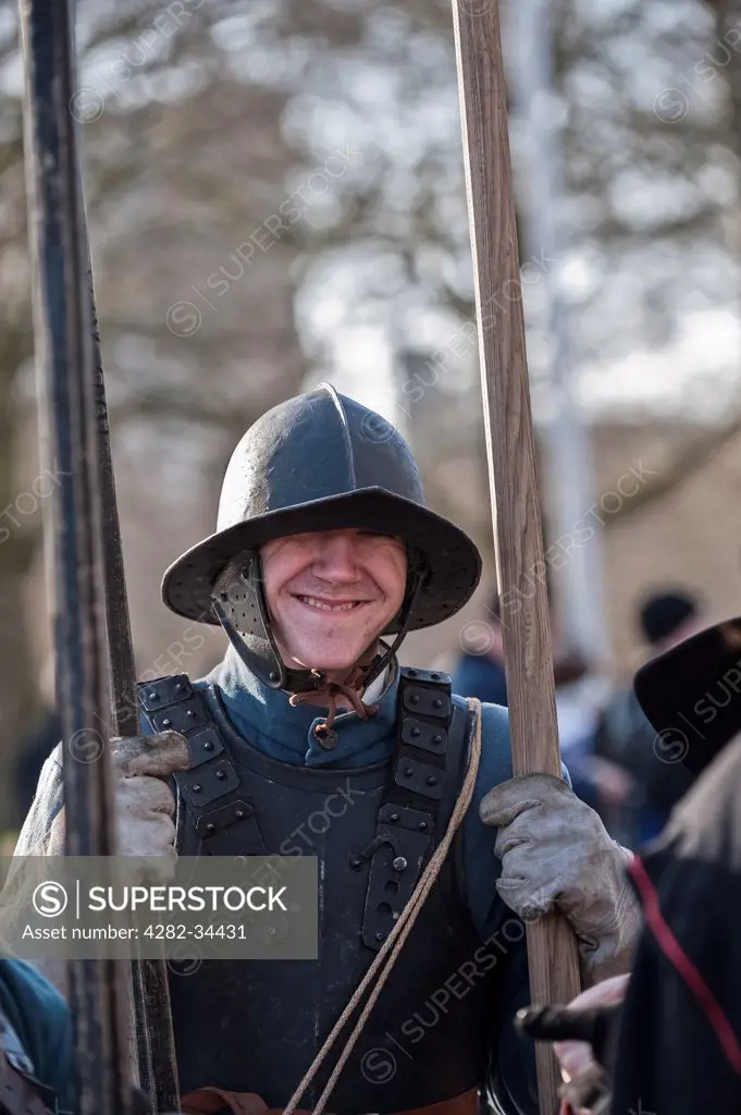 England, London, The Mall. A member of the English Civil War Society preparing to march to commemorate the execution of King Charles I.