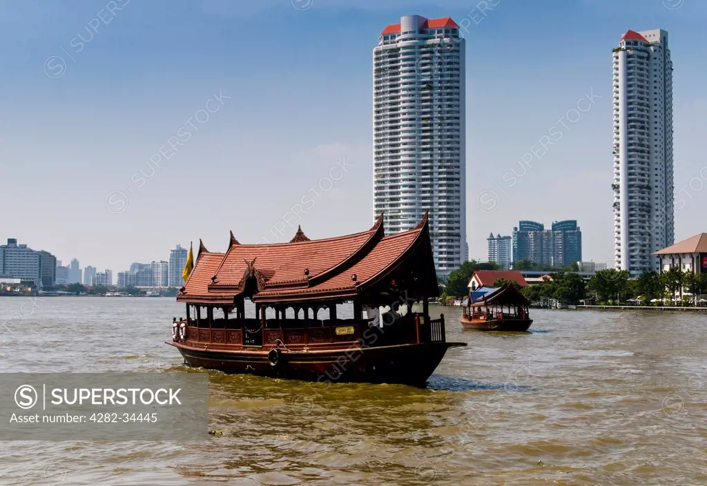 Thailand, Central Thailand, Bangkok Chao Praya River. Tourist boats sailing on the Chao Praya River in Bangkok.
