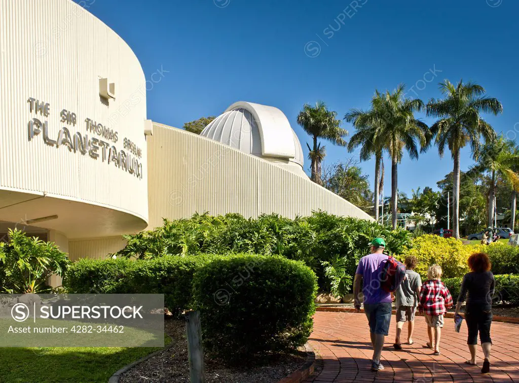 Australia, Queensland, Brisbane. Tourists walking into The Sir Thomas Brisbane Planetarium in Brisbane Botanic Gardens.