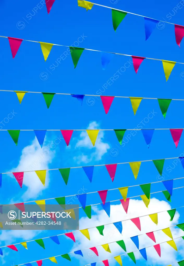 England, Cornwall, Falmouth. Bunting against a blue sky.