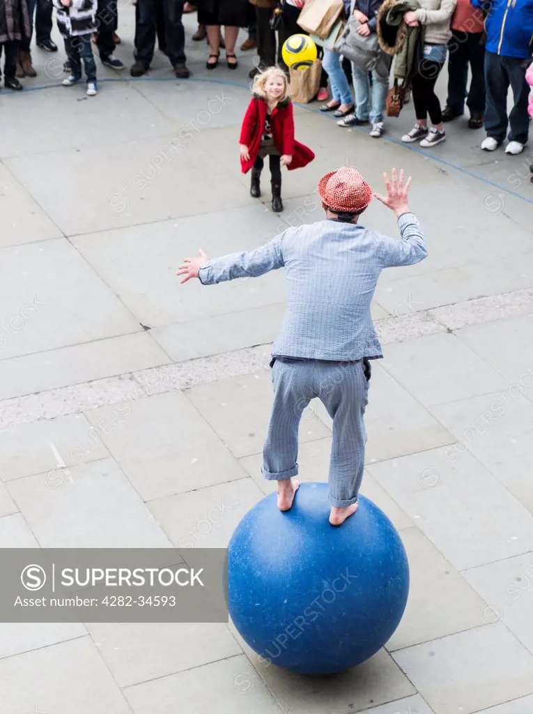 England, London, Trafalgar Square. A street performer entertaining people in London.