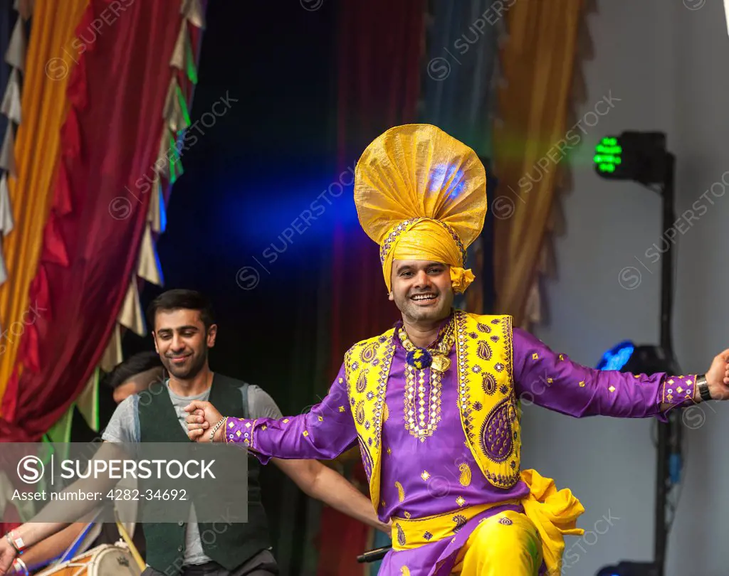 England, London, Trafalgar Square. A traditional Punjabi dancer at the Vaisakhi Festival in Trafalgar Square.