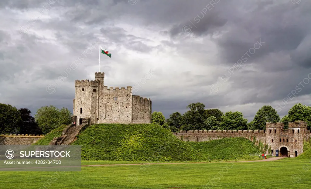 Wales, South Glamorgan, Cardiff. Storm clouds over Cardiff Castle keep.