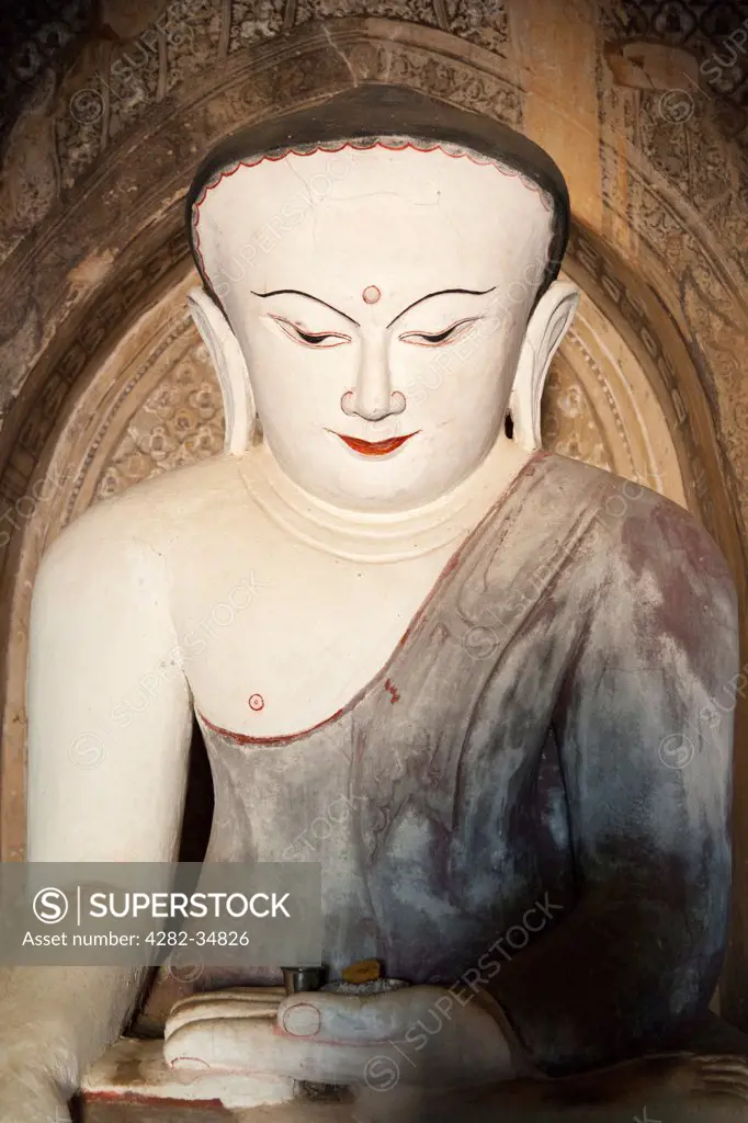 Myanmar, Mandalay, Bagan. A bulbous headed Buddha in the Nanbaya Temple in Bagan in Myanmar.