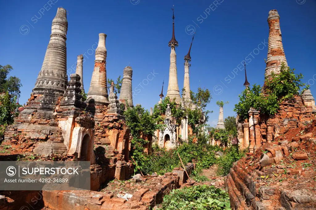 Myanmar, Shan, Shwe Inn Thein. The abandoned and overgrown pagodas of Inn Thein in Myanmar.