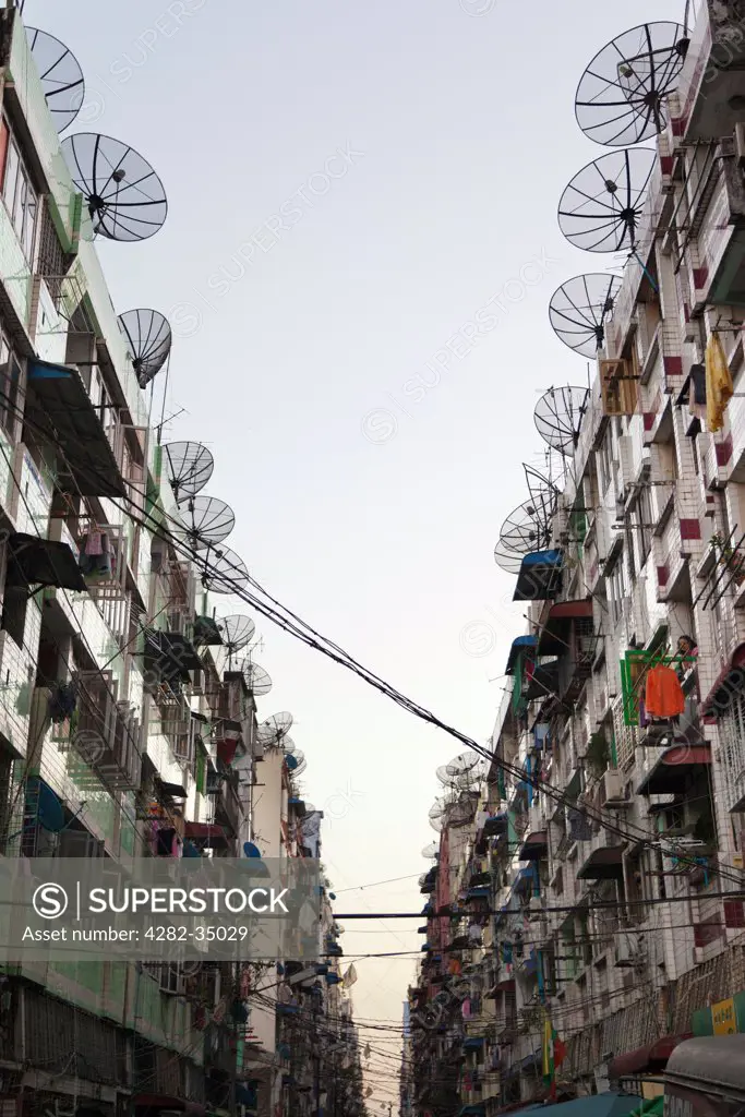 Myanmar, Yangon, Yangon. A gaunt, grey street lined with satellite dishes in downtown Yangon in Myanmar.