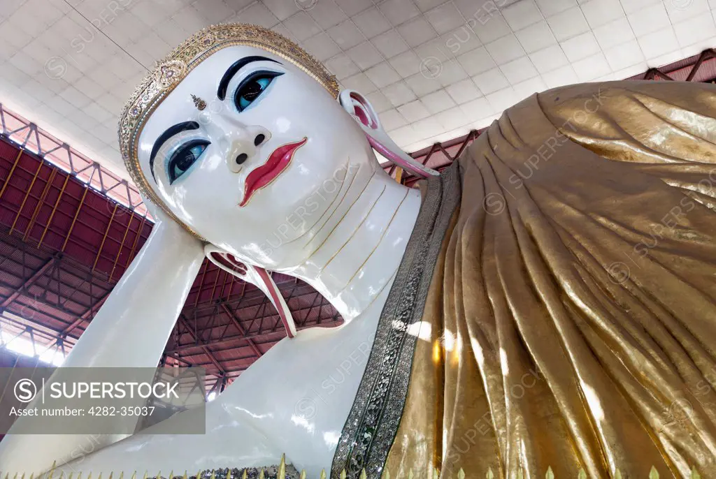 Myanmar, Yangon, Yangon. The face of the reclining Buddha at Chauk Htat Gyi in Yangon in Myanmar.