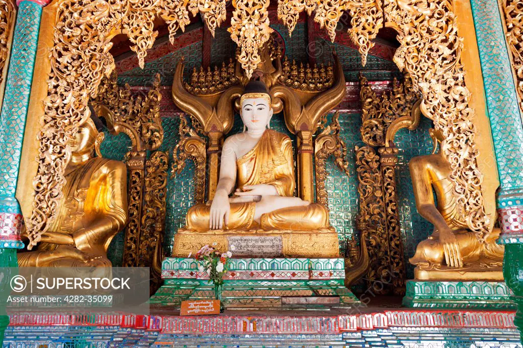 Myanmar, Yangon, Yangon. Ornate Buddhas at the Shwedagon Temple Complex in Yangon in Myanmar.