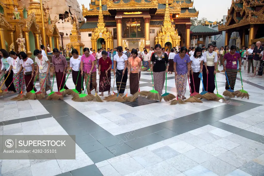 Myanmar, Yangon, Yangon. The evening ritual of cleaning the Shwedagon Temple Complex in Yangon in Myanmar.