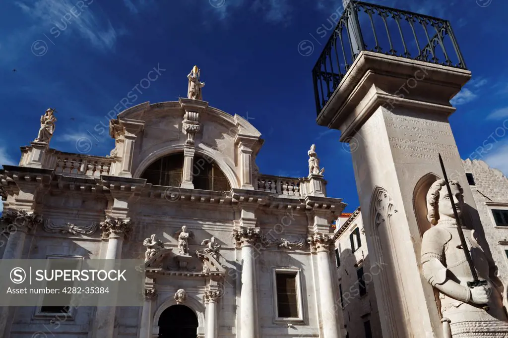 Croatia, Dalmatia, Dubrovnik. Orlando's Column and the Baroque Church of St Blaise in Dubrovnik.