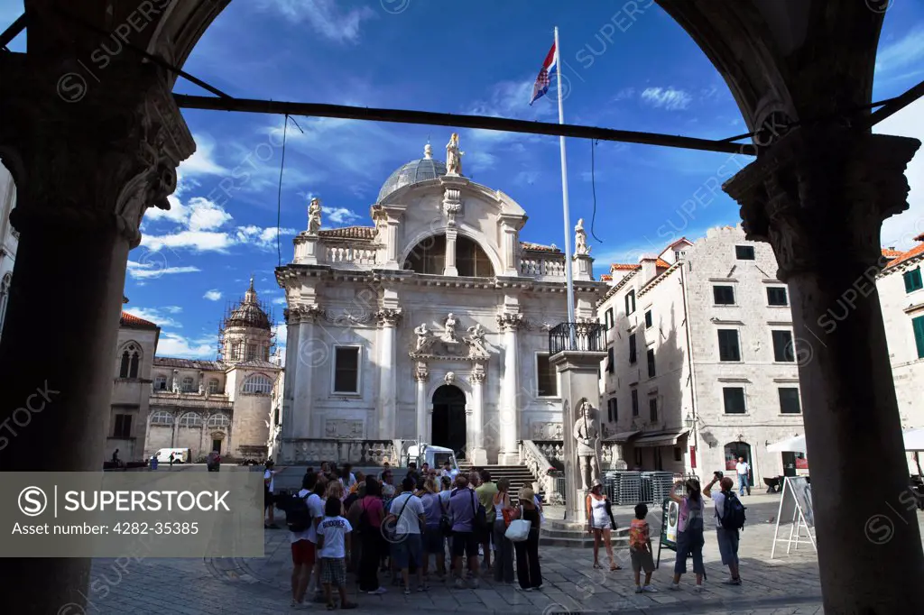 Croatia, Dalmatia, Dubrovnik. Tourists outside the church of St. Blaise in the main square in Dubrovnik.