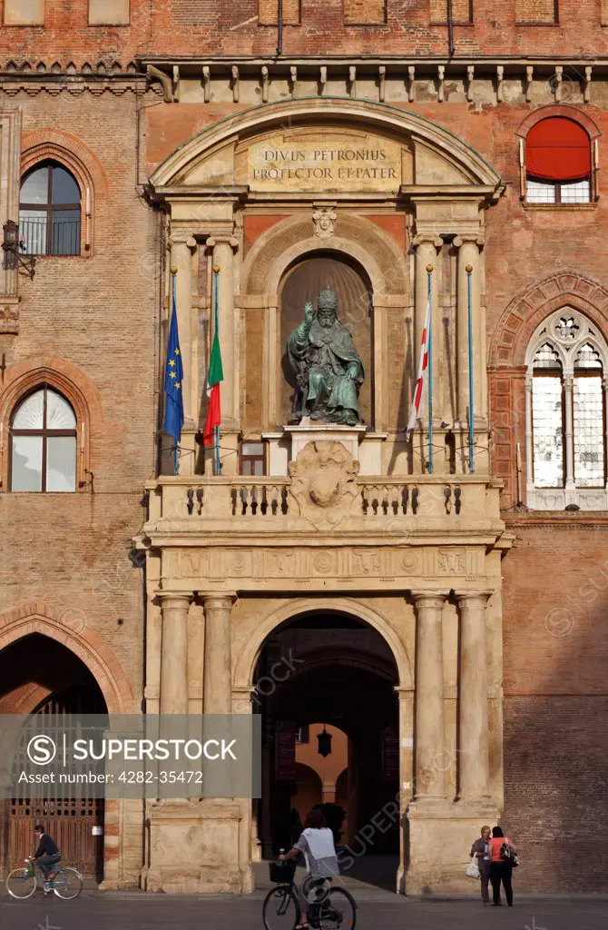 Italy, Emilia-Romagna, Bologna. Statue of Pope Gregorius XIII and the Palazzo Comunale in Piazza Maggiore Square in Bologna.
