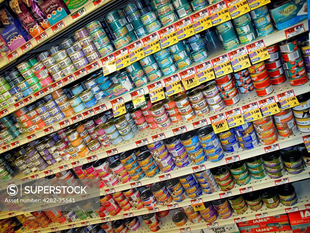 USA, New Jersey, Mount Laural. Varieties of canned cat food products on a store shelf.