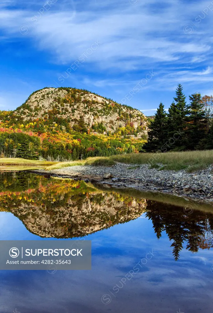 USA, Maine, Acadia National Park. Beehive mountain reflected in a salt pond at Sand Beach in Acadia National Park.