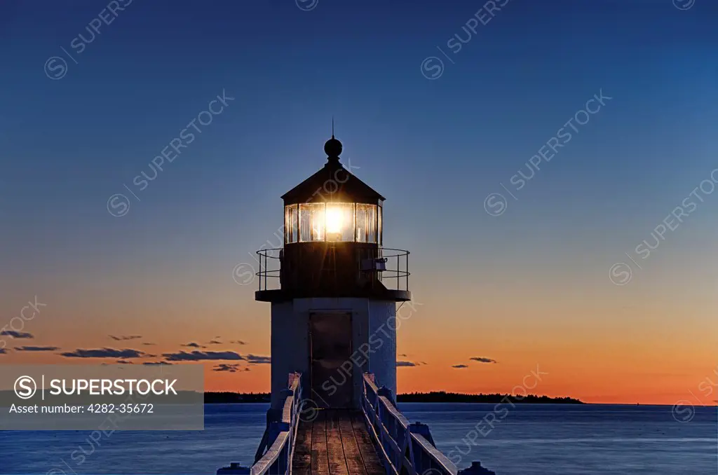 USA, Maine, Port Clyde. Marshall Point Lighthouse in Port Clyde at dusk.