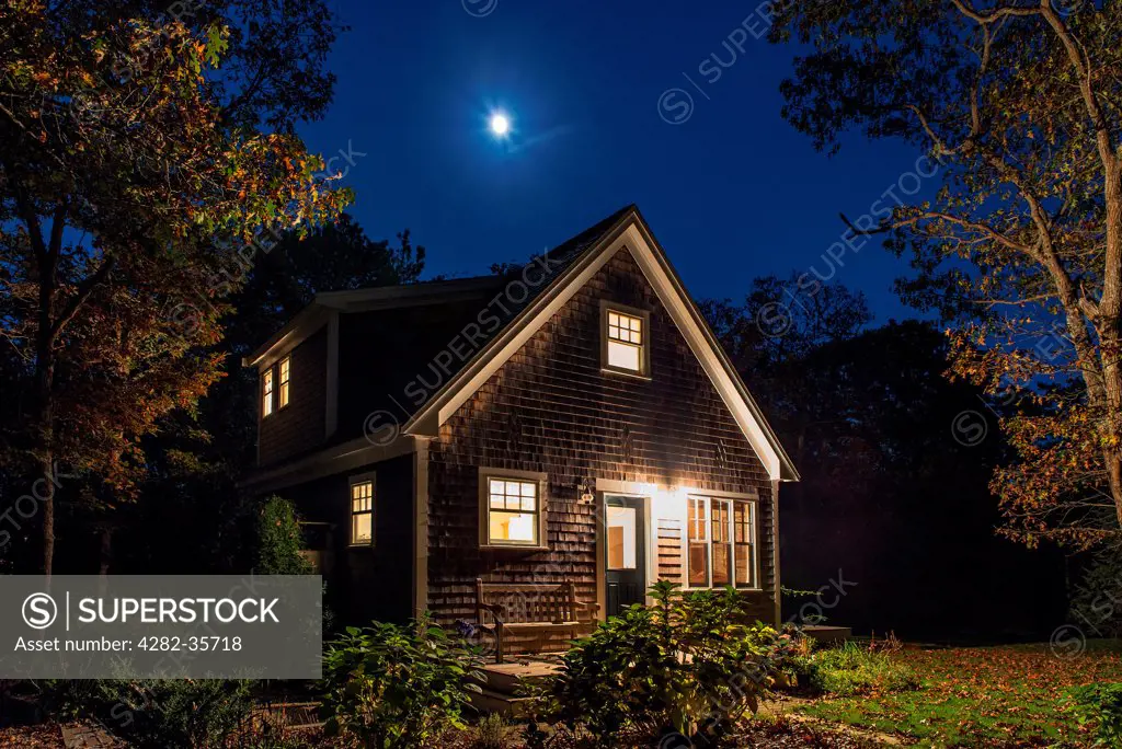 USA, Massachusetts, Marthas Vineyard. A cosy bungalow at night in Marthas Vineyard.