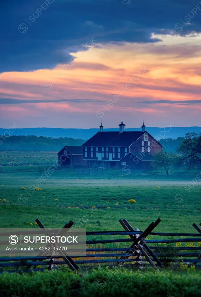 USA, Pennsylvania, Gettysburg. The Codori Farm on a misty evening in Gettysburg National Military Park.