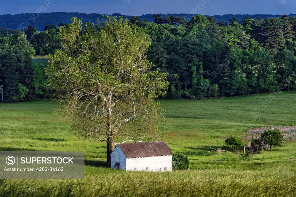 USA, Delaware, Valley Forge. A rural spring house in the lush pastoral landscape of Chester County.