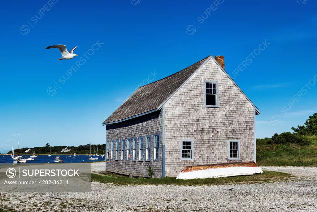 USA, Massachusetts, Cape Cod. A boat house in Chatham Harbor.