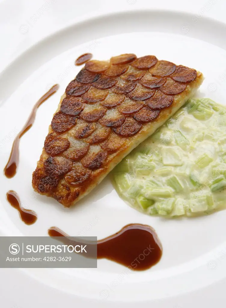 England, West Midlands, Birmingham. Sea bream with potato scales, creamed leeks in a red wine sauce. Simpsons Restaurant in Edgbaston is a Michelin starred restaurant.