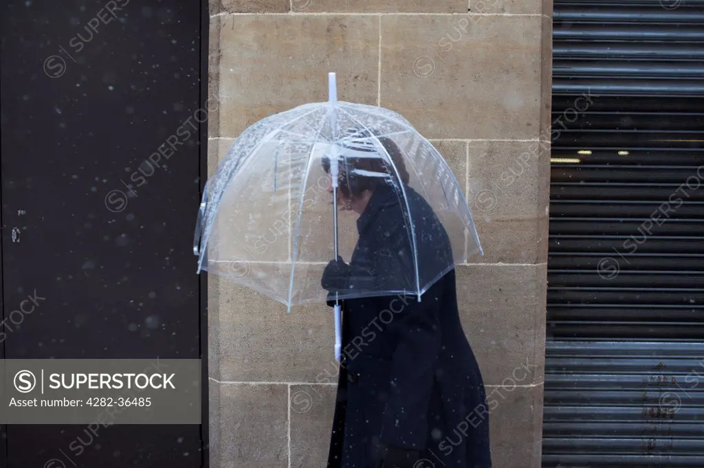 England, West Midlands, Birmingham. Woman with an umbrella.