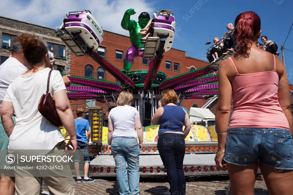 England, Bristol, Bristol. People at a funfair during the Harbour festival.