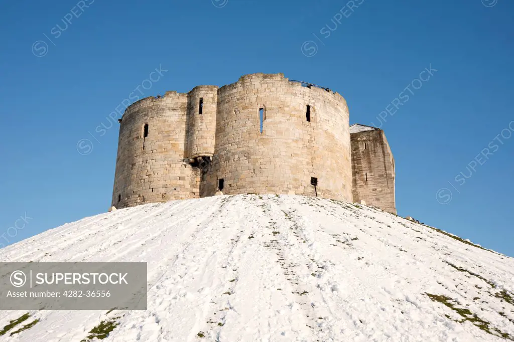 England, North Yorkshire, York. The ruins of Cliffords Tower in winter.