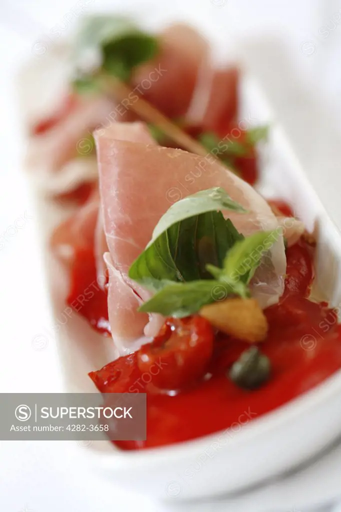 England, West Midlands, Birmingham. Salad of roasted red peppers with parma ham, olive crisps and basil. Cielo Restaurant in Brindleyplace.