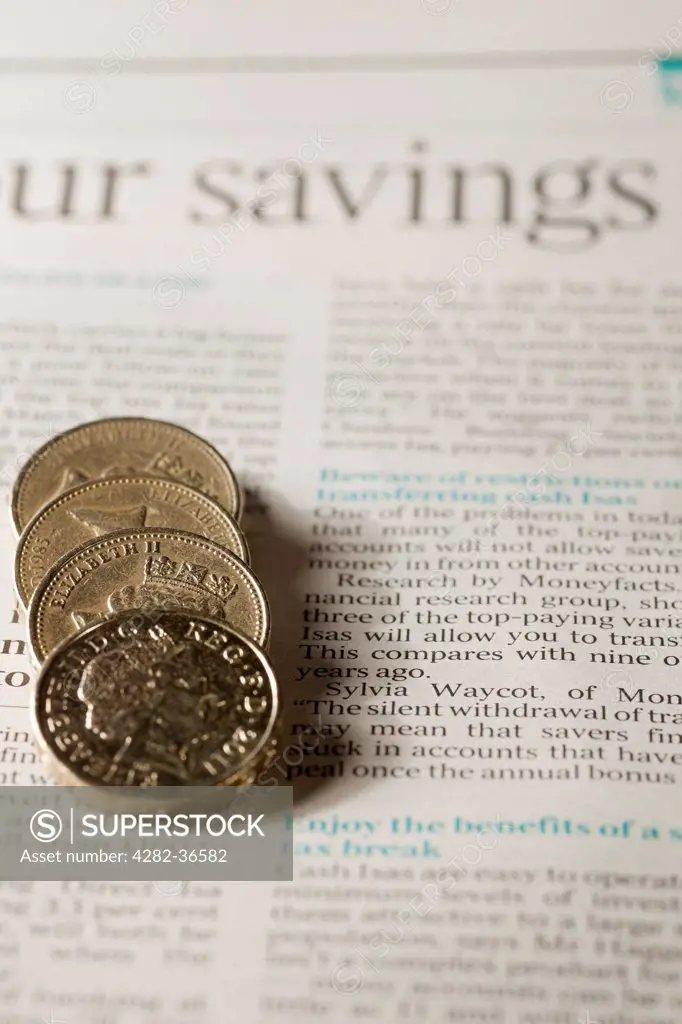 England, North Yorkshire, York. English pound coins on a page of financial newspaper.