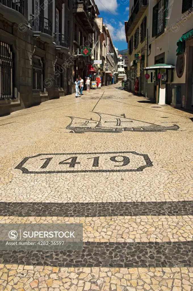 Portugal, Madeira, Funchal. One of the many mosaic decorated streets in Funchal.