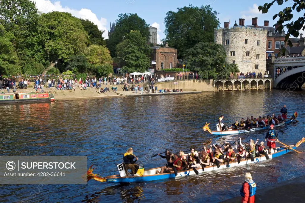 England, North Yorkshire, York. Boats taking part in the Dragon Boat Challenge on the River Ouse.