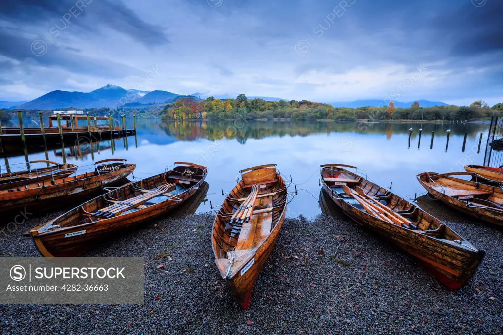 England, Cumbria, Keswick. Rowing boats on the shore of Derwent Water near Keswick.