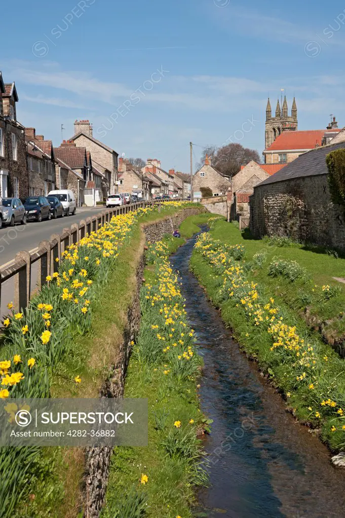 England, North Yorkshire, Helmsley. A view along a stream in Helmsley.