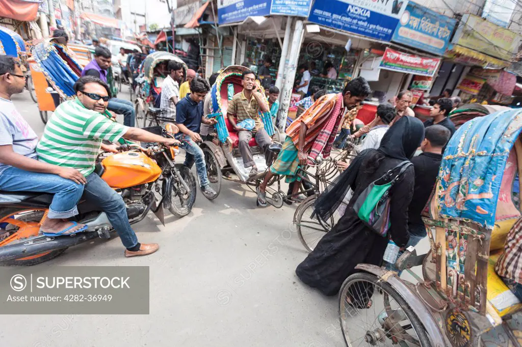 Bangladesh, Dhaka, Dhaka. A typical cycle rickshaw traffic jam in Dhaka.