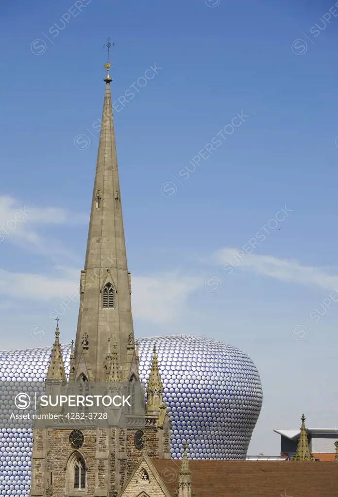 England, West Midlands, Birmingham. St. Martins Church in front of the Selfridges Building at The Bullring Shopping Centre.