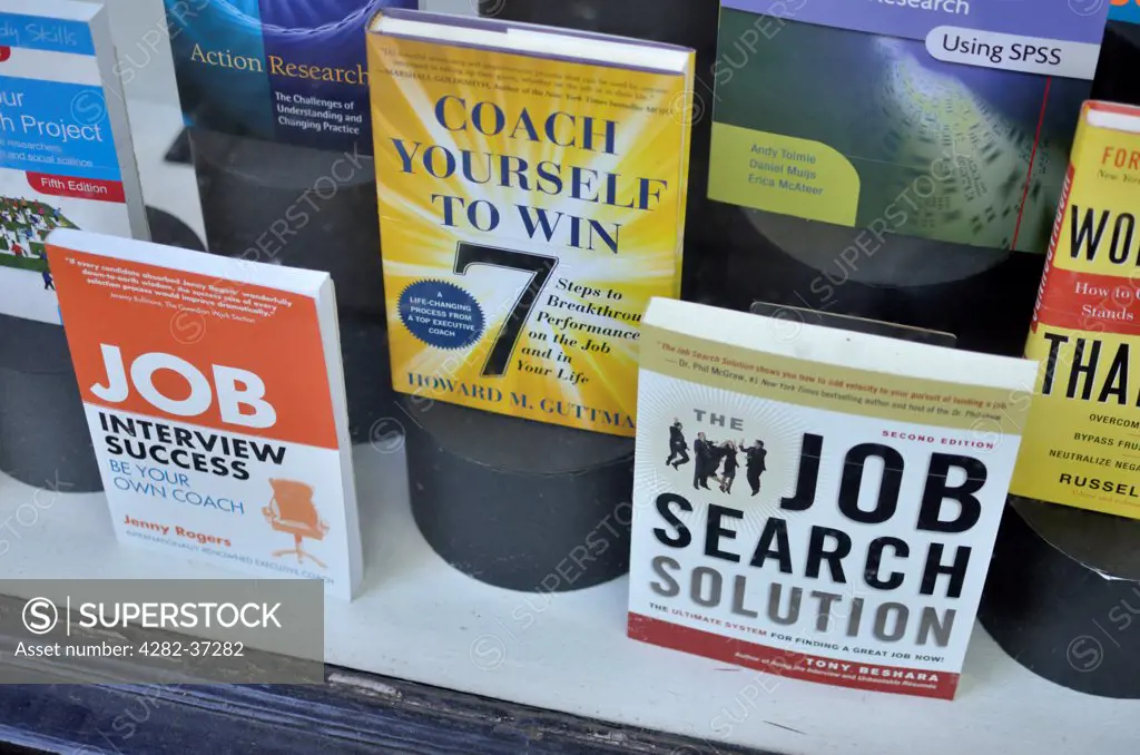 England, London, Bloomsbury. A shop window displaying motivational books aimed at helping to find a job.