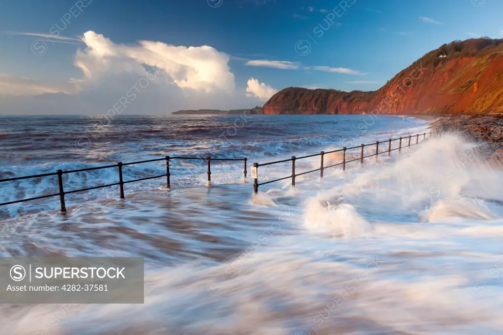 England, Devon, Sidmouth. Waves crashing over the walkway in Sidmouth.