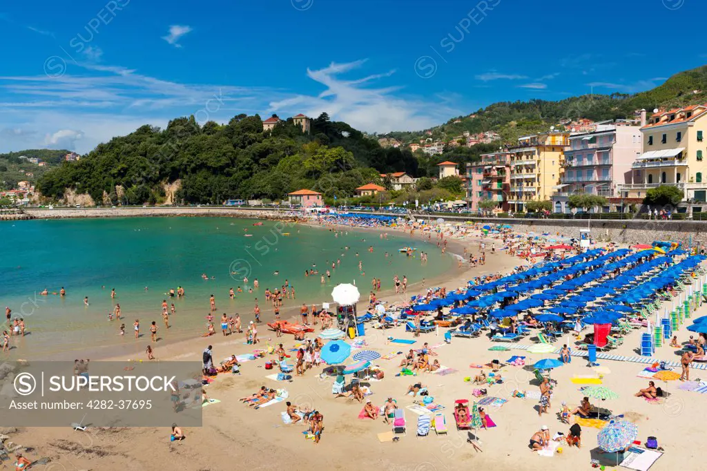 Italy, Liguria, Lerici. Tourists on the beach at Lerici.
