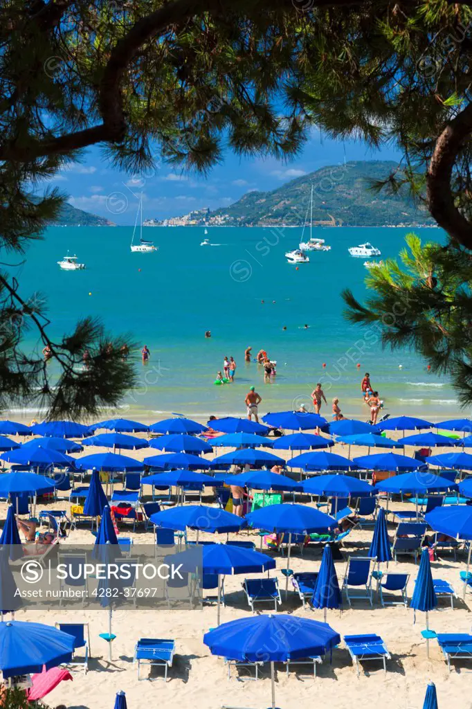 Italy, Liguria, Lerici. Tourists on the beach at Lerici.