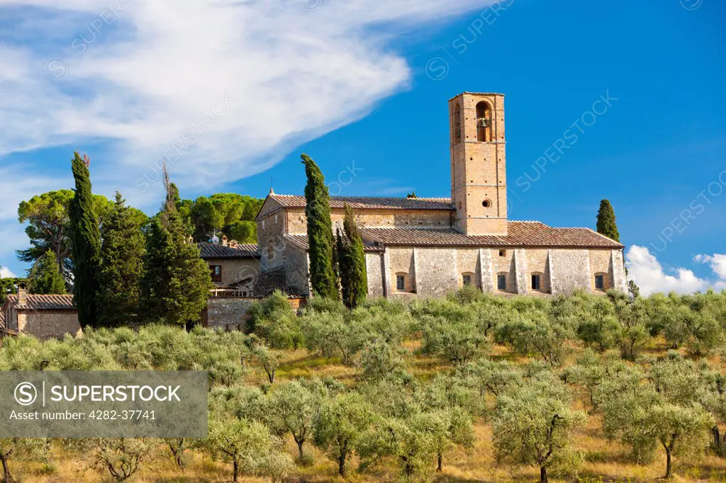 Italy, Toscana, San Gimignano. Rolling landscape with church in the background at San Gimignano.