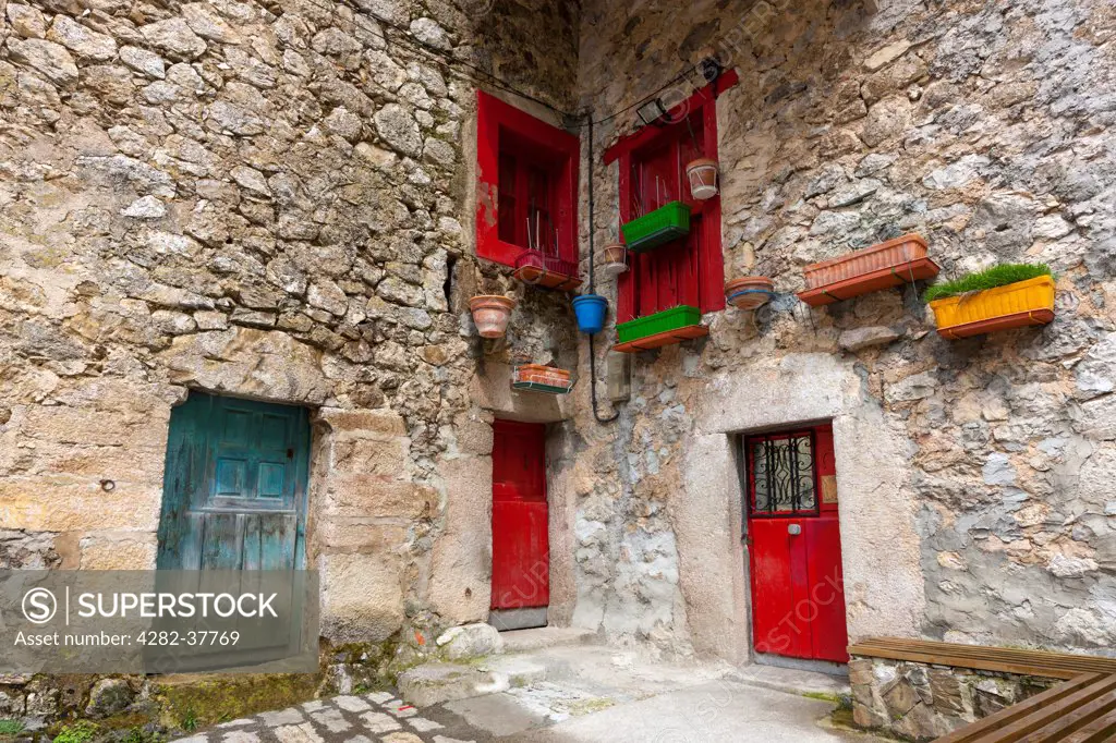 Spain, Asturias, Bulnes El Castillo. Colorful doors and windows in countryside house in the Picos de Europa National Park.