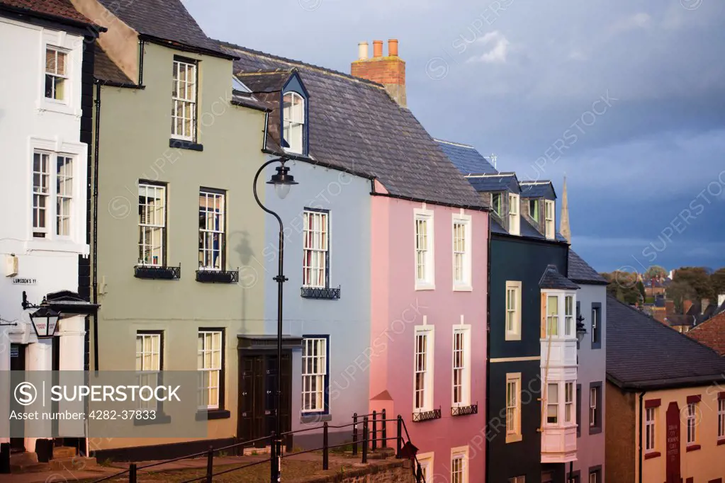 England, County Durham, Durham. A view of a street with brightly painted houses in Durham.