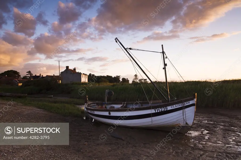 England, Norfolk, Brancaster Staithe. A fishing boat at Brancaster Staithe on the North Norfolk Coast.