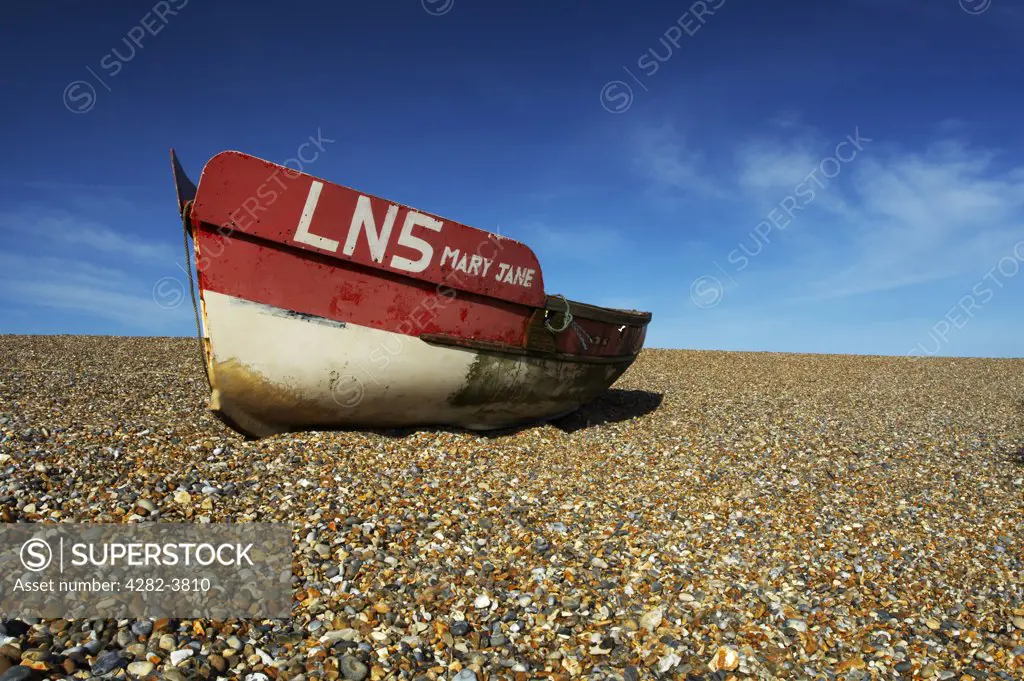 England, Norfolk, Cley Next The Sea. A fishing boat on the beach at Cley on the Norfolk Coast.