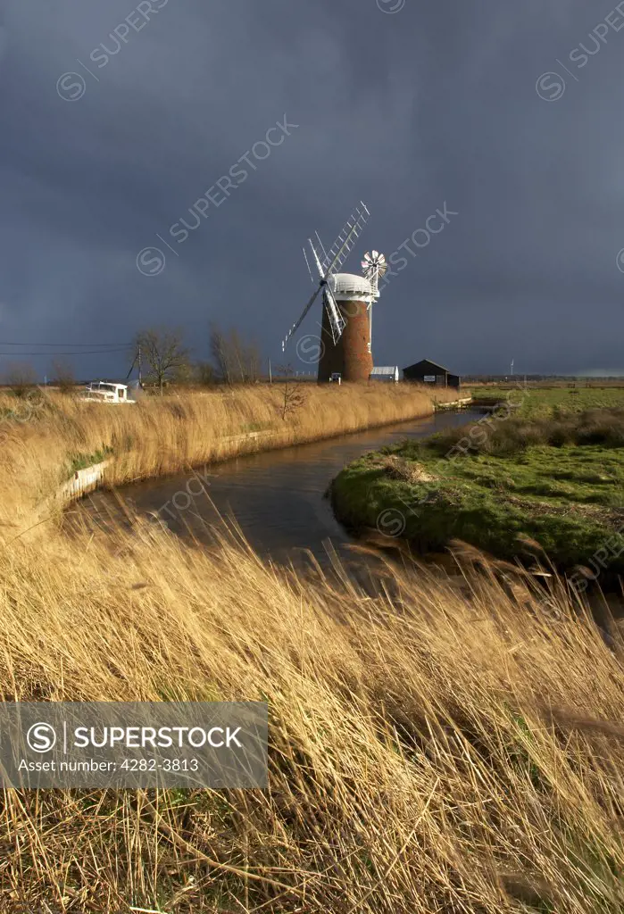 England, Norfolk, Horsey Windmill. Horsey Windmill and Staithe after a storm over the Norfolk Broads.