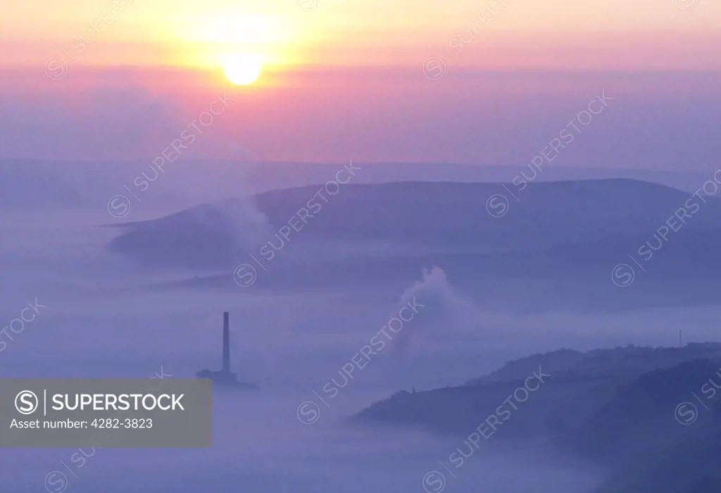 England, Derbyshire, Hope Valley. The Hope Valley cement works at sunrise in the Derbyshire Peak District.