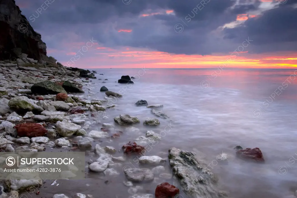England, Norfolk, Hunstanton. Hunstanton beach at sunset on the North Norfolk Coast.